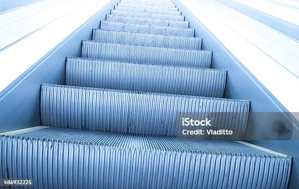 Modern Steps Of Moving Business Escalator Stock Photo - Download Image Now - Airport, Architecture, Blue