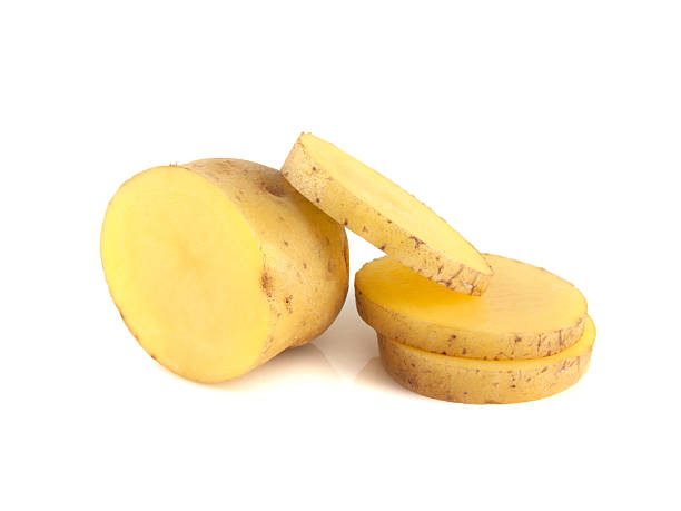 istock New potato half with slices isolated on white 486932507