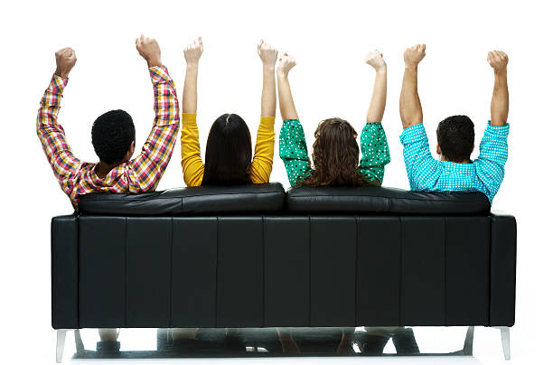 istock Four friends sitting of sofa 486932754