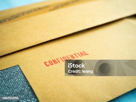istock "Confidential" printed on brown vintage envelope, in macro 486932896