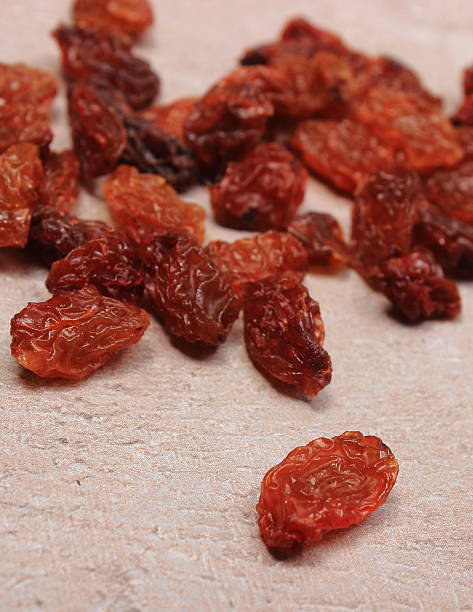 istock Brown raisins on structure of concrete, healthy eating 486932964