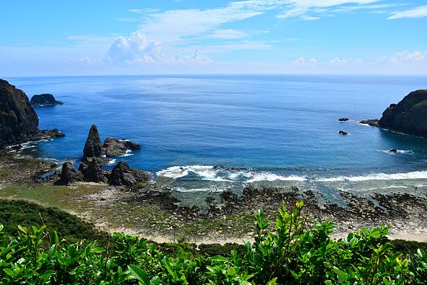 istock Jagged rocks with blue and zigzag coastline 486933982