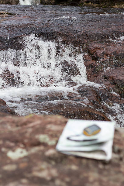 istock Waterfall and travel equipment 486934367