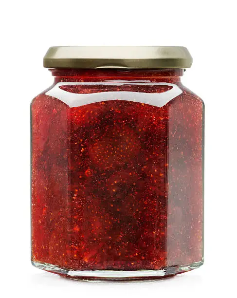 Strawberry jam glass jar isolated on white background