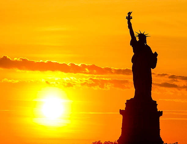 The Statue of Liberty in silhouette.