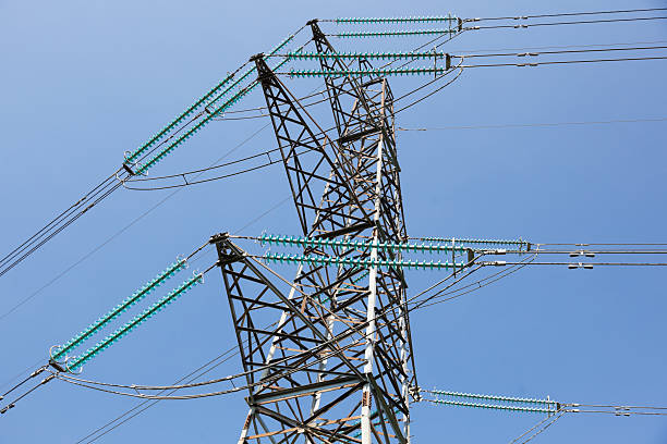 istock Electricity pylon on a clear blue sky. 486935065