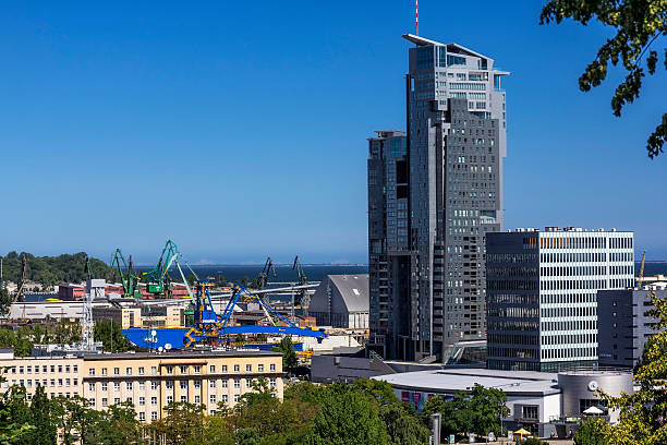 Aerial view of modern skyscrapers and harbour in background, Gdynia, Poland