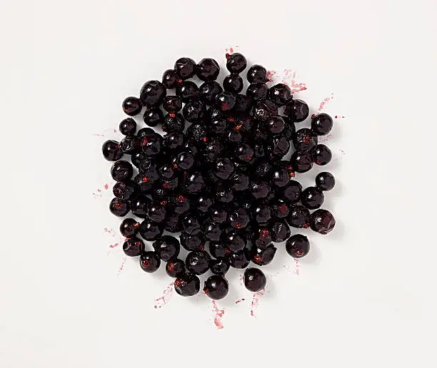 Blackcurrants on a white background