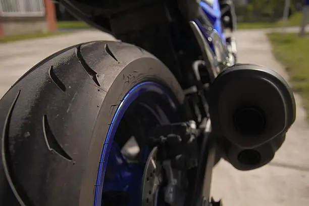Rear view of motorcycle. Sport tyre for extreme grip.