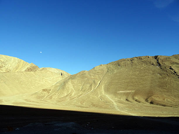 Magnetic hill Magnetic hill on the moonland. Desert moonland. Ladakh "land of high passes" is a region of India in the state of Jammu and Kashmir that lies between the Kunlunmountain range in the north and the main Great Himalayasto the south, inhabited by people of Indo-Aryan and Tibetandescent. moonland stock pictures, royalty-free photos & images