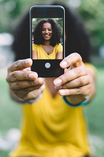 istock Smiling woman taking a selfie 486940974