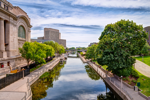 Urban scene of buildings and Rideau canal, cloudy sky in background. HDR effect.
