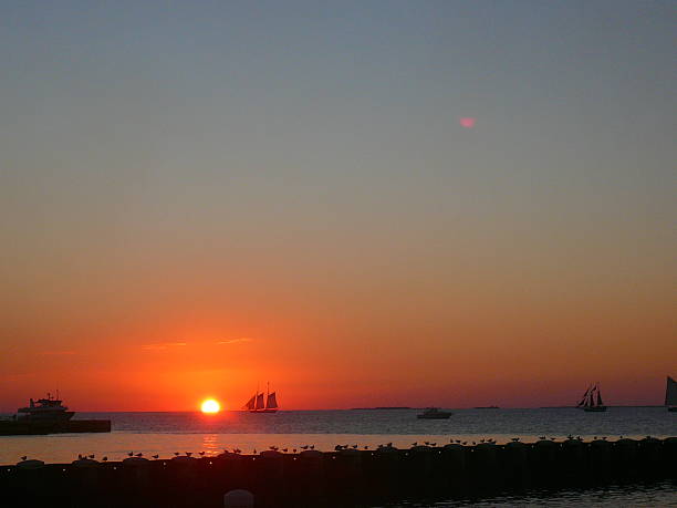 istock Sunset at Key West with sailing boat and bright sky 486949926