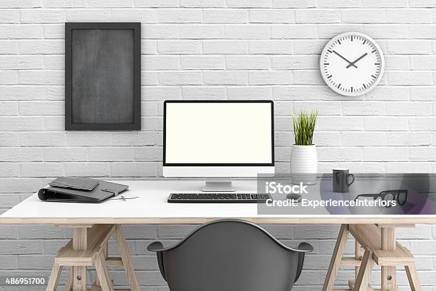 Table With Pc In Front Of A White Wall Stock Photo - Download Image Now - Desk, Computer Monitor, Office