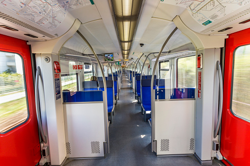 Frankfurt, Germany - September 11, 2015: Interior of the electric multiple unit of Frankfurt am Main - S-Bahn system. At the ceiling you see the operating S-Bahn lines.