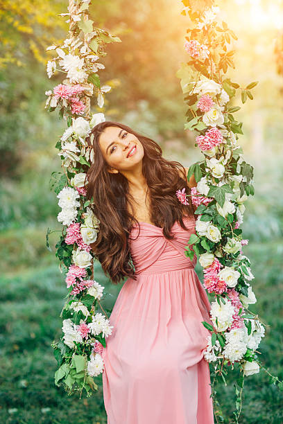 istock Beautiful young girl on a swing 486952452