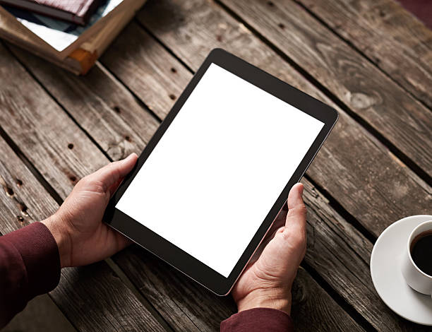 istock Man shows screen of tablet in his hands 486953696