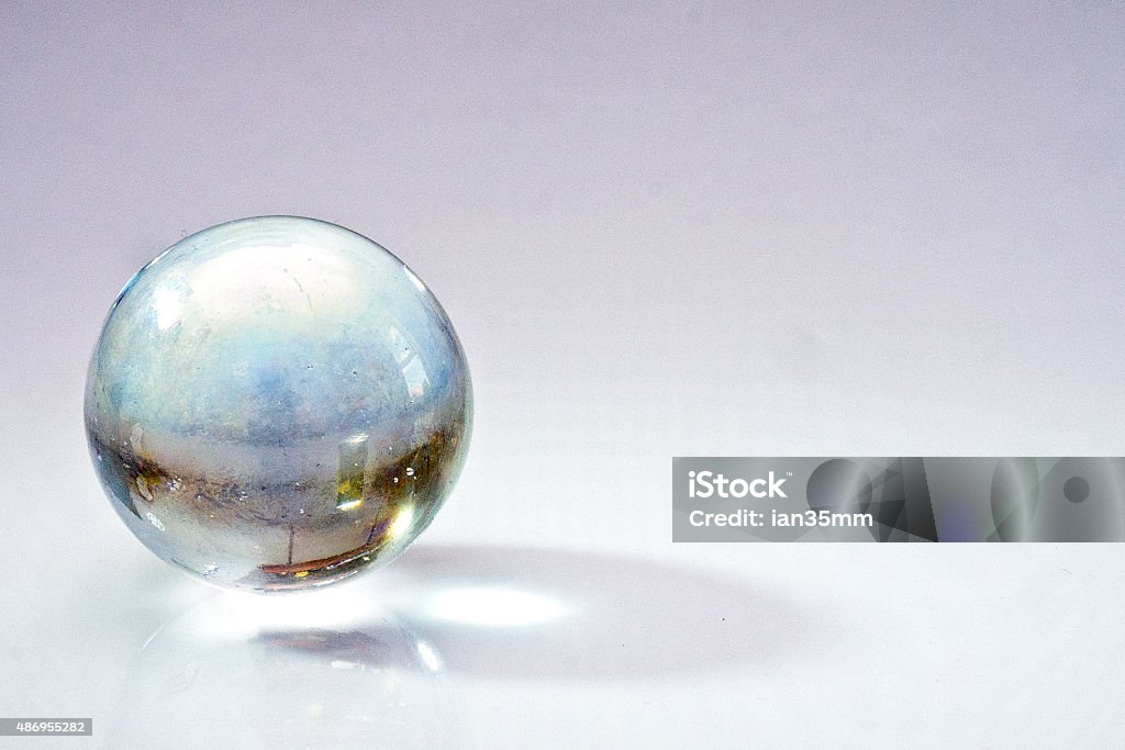 Old glass marble Isolated old glass marble. Glass - Material Stock Photo