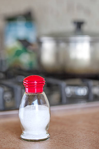 Salt shaker on table stock photo