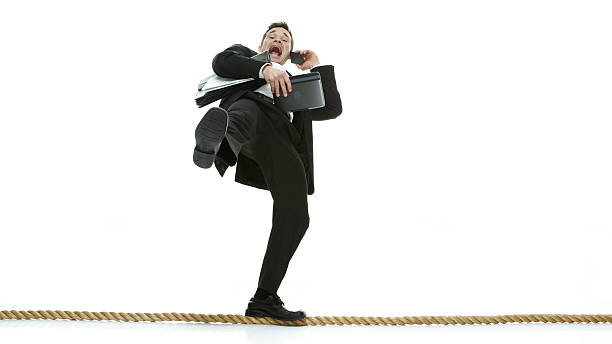 istock Businessman walking on tight rope 486956982