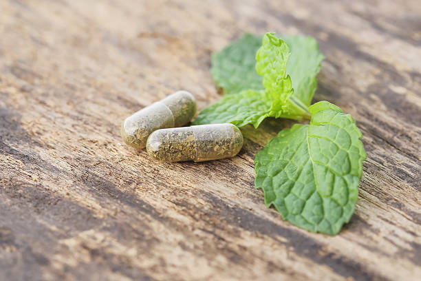 istock herbal medicine pills on the old wood 486961438