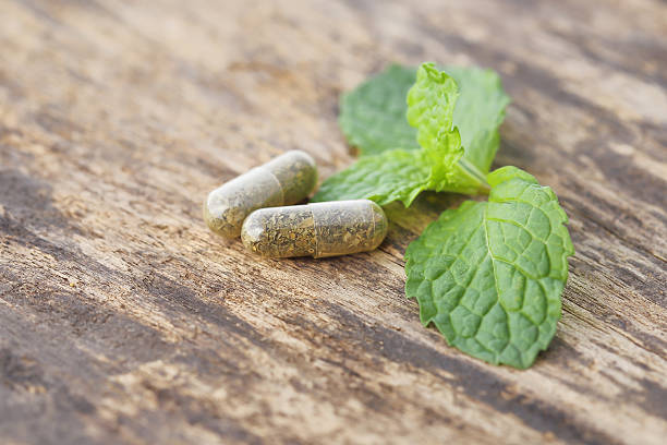 istock herbal medicine pills on the old wood 486961632