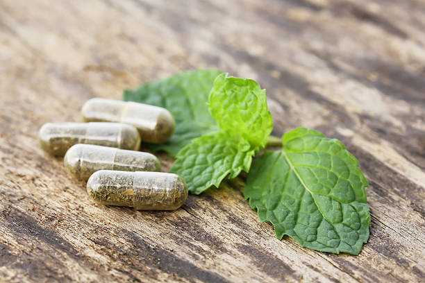 istock herbal medicine pills on the old wood 486961836