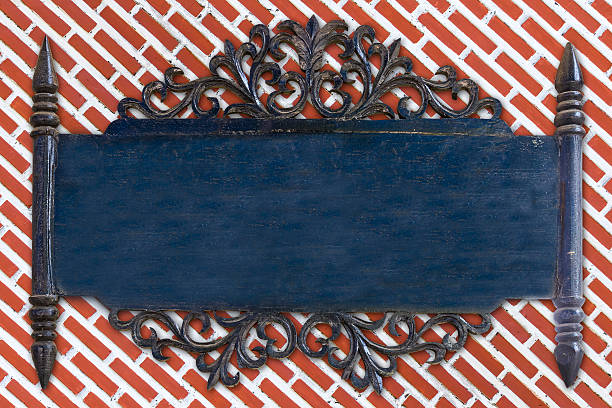 blue wooden sign thai style on red brick background.