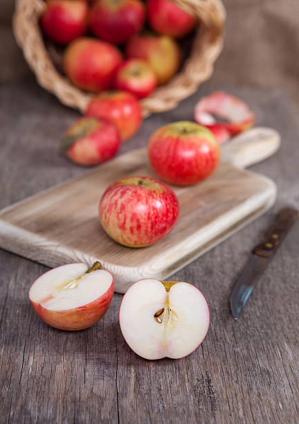 istock Autumn crops: red apples on a dark wooden table 486965948