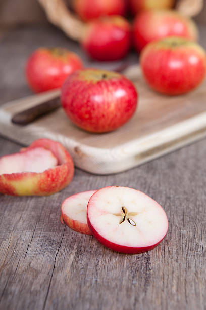 istock Autumn crops: red apples on a dark wooden table 486966180