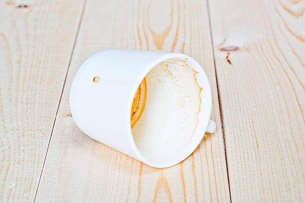 istock empty dirty cup of coffee lying on the boards 486968262
