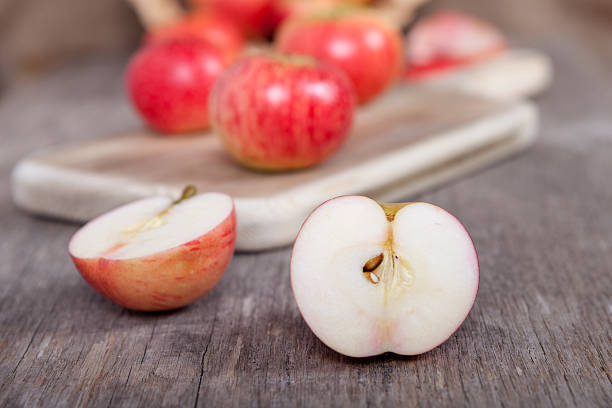 istock Autumn crops: red apples on a dark wooden table 486969936