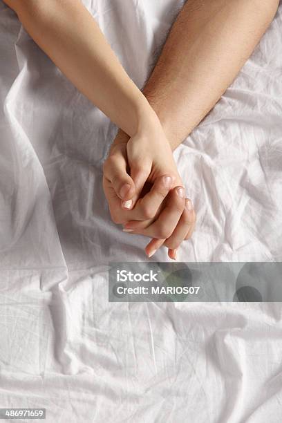 Lovers Stock Photo - Download Image Now - Couple - Relationship, Bed - Furniture, Holding Hands