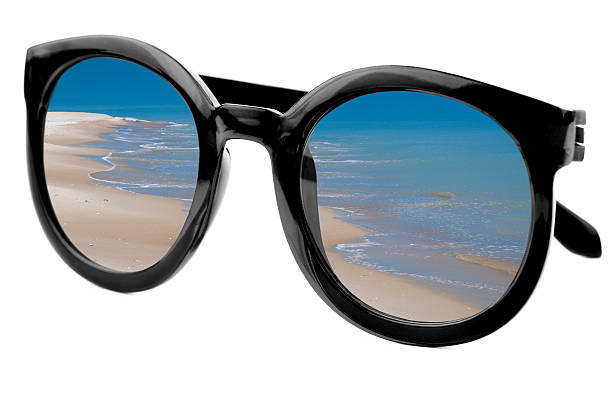 istock Summertime concept -  Sunglasses have a beach  reflecting on  is 486972052