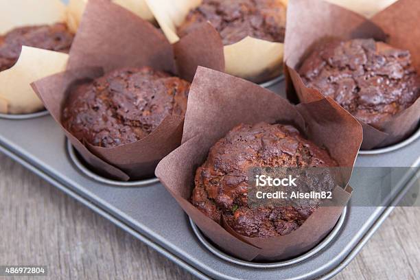 Flourless Chocolate Courgette Muffins In A Muffin Tin Stock Photo - Download Image Now