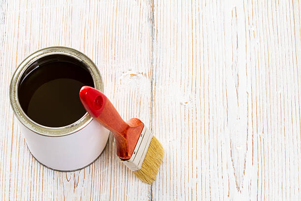 istock Paint brush varnish can, paintbrush and lacquer color container 486973177