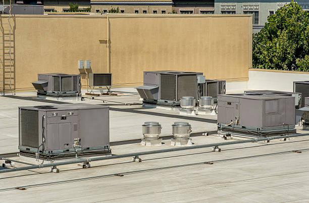 Rooftop HVAC HVAC installation on a membrane roof. chiller hvac equipment photos stock pictures, royalty-free photos & images