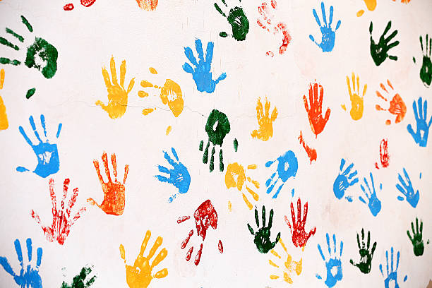 istock Wall with colored prints of human hand 486974862