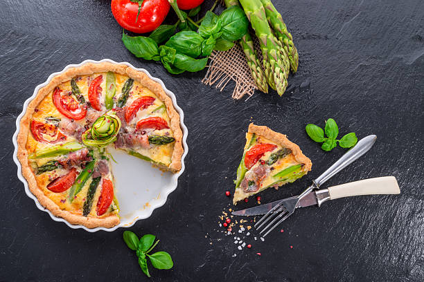 istock green asparagi Tart with eggs and tomato 486976701