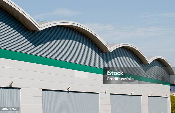 Industrial Warehouse Stock Photo - Download Image Now - Rooftop, Warehouse, Curve