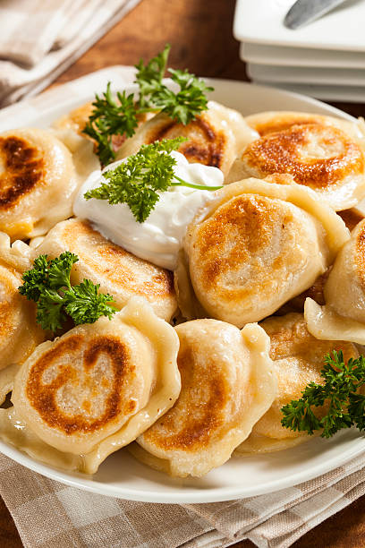 istock Homemade Polish Pierogis with Sour Cream 486977779