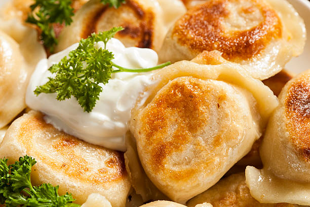 istock Homemade Polish Pierogis with Sour Cream 486977781