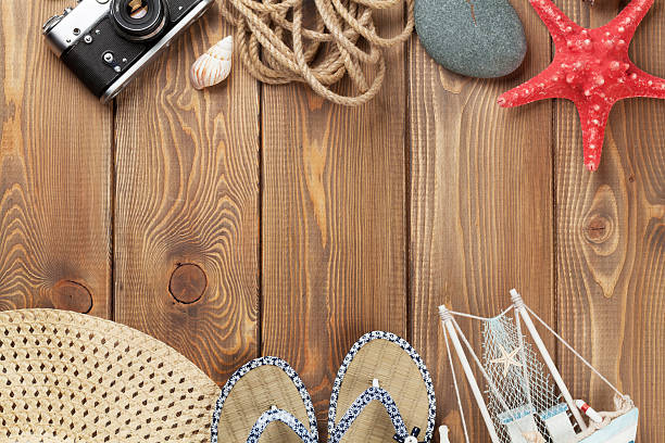 istock Travel and vacation items on wooden table 486978166