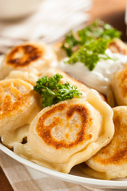 istock Homemade Polish Pierogis with Sour Cream 486978309