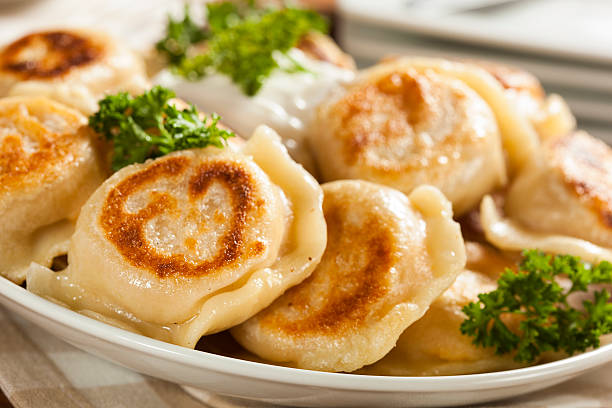 istock Homemade Polish Pierogis with Sour Cream 486978311