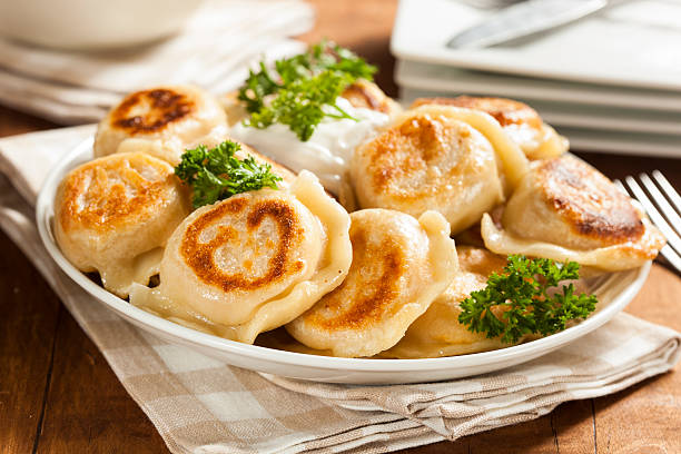 istock Homemade Polish Pierogis with Sour Cream 486978313