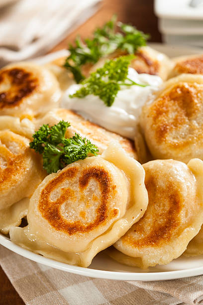 istock Homemade Polish Pierogis with Sour Cream 486978317