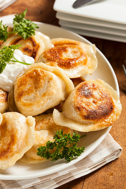istock Homemade Polish Pierogis with Sour Cream 486978319