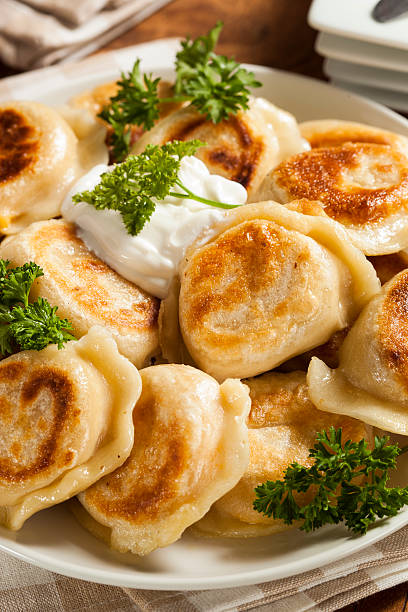 istock Homemade Polish Pierogis with Sour Cream 486978321