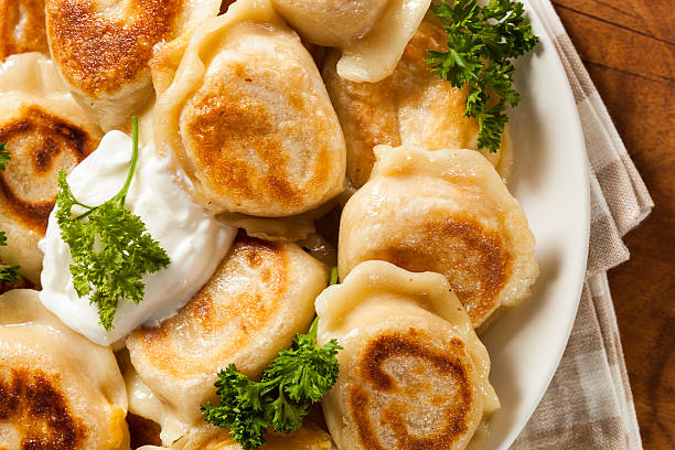 istock Homemade Polish Pierogis with Sour Cream 486978323